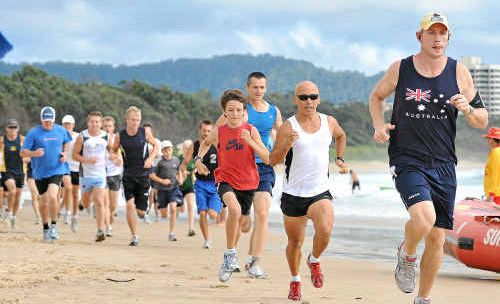 Runners head back to the surf clubhouse in the early stages of the 2010 Australia Day Fun Run. Runners head back to the surf clubhouse in the early stages of the 2010 Australia Day Fun Run.
